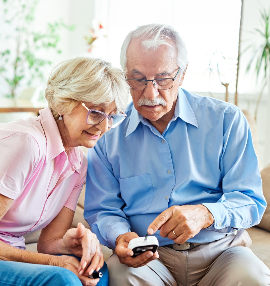 Portrait,Of,Senior,Couple,Using,Lancet,On,Finger,For,Checking